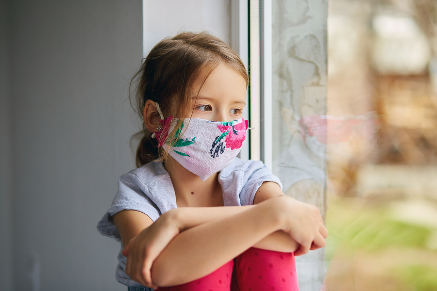 Little Girl, Child In Mask Sits On Windows, Coronavirus Quaranti